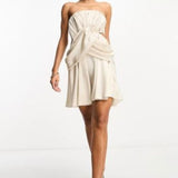 Asos Design Satin Bandeau Drape Twist Mini Dress With Cut Out Detail In Gold – dresses by ASOS DESIGN, available to rent from Hirestreet