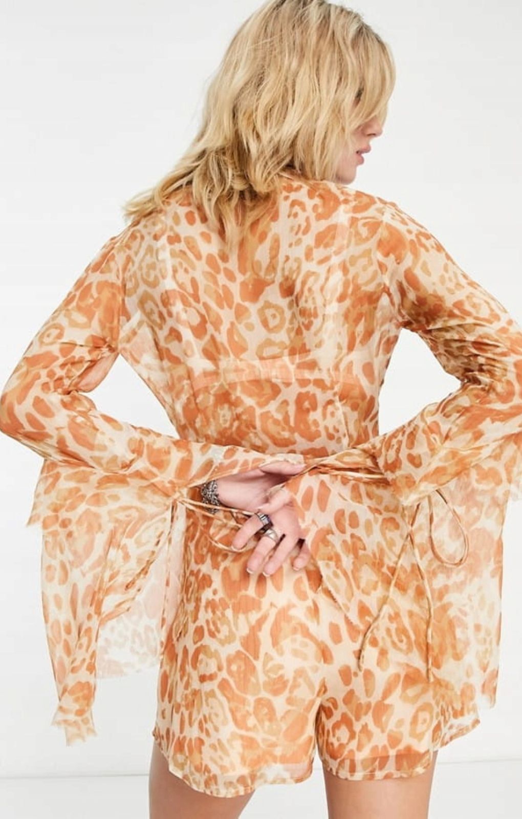 Asos Design Deep V Neck Ruffle Sleeve Playsuit In Washed Leopard Print – jumpsuits & playsuits by ASOS DESIGN, available to rent from Hirestreet