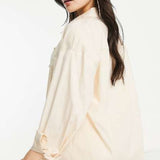 Vero Moda X Joann Van Den Herik Oversized Shirt In Stone – tops by Vero Moda, available to rent from Hirestreet