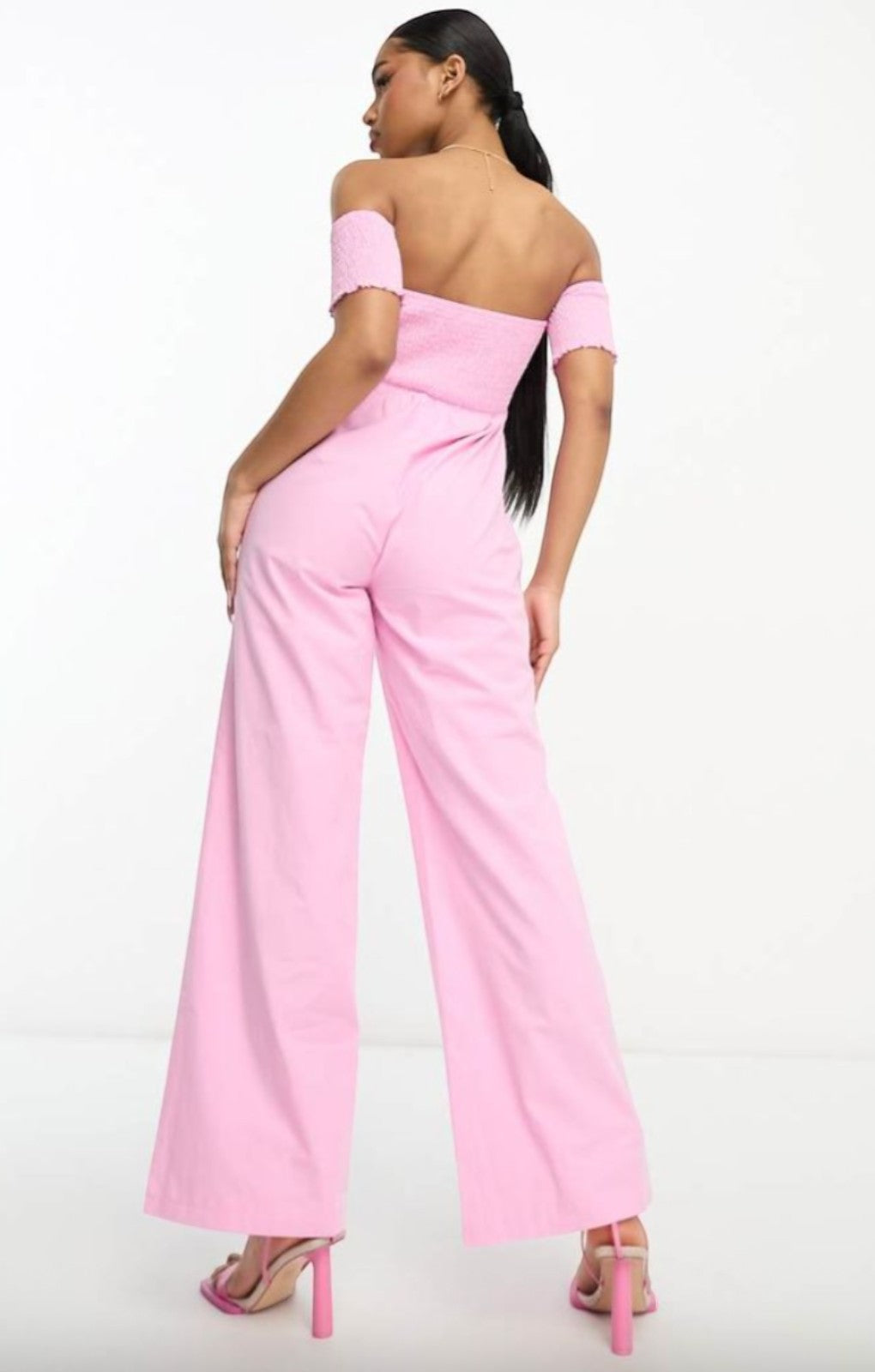 The Frolic Exclusive Shirred Off Shoulder Wide Leg Jumpsuit In Pink – jumpsuits & playsuits by The Frolic, available to rent from Hirestreet