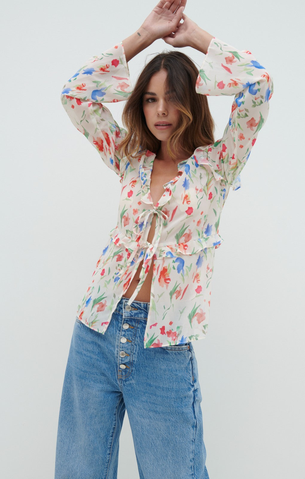 Pretty Lavish Tomlin V Neck Dainty Floral Ruffle Tie Blouse – tops by Pretty Lavish, available to rent from Hirestreet