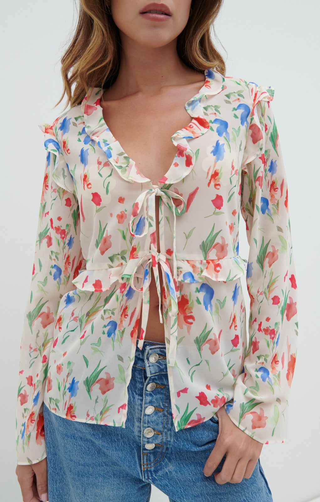 Pretty Lavish Tomlin V Neck Dainty Floral Ruffle Tie Blouse – tops by Pretty Lavish, available to rent from Hirestreet