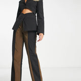 Collusion Straight Spliced Trousers In Black And Brown – trousers by Collusion, available to rent from Hirestreet