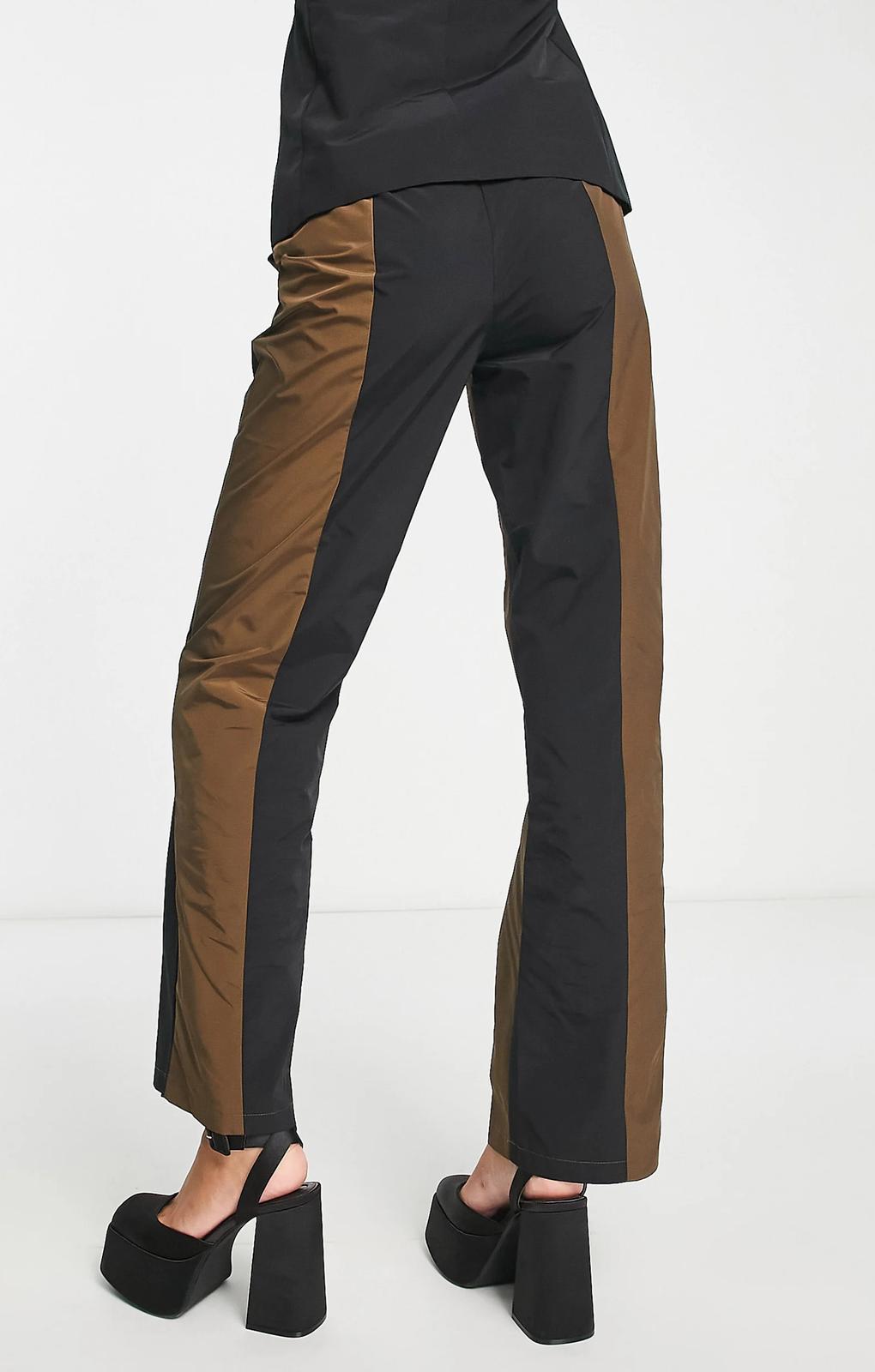 Collusion Straight Spliced Trousers In Black And Brown – trousers by Collusion, available to rent from Hirestreet