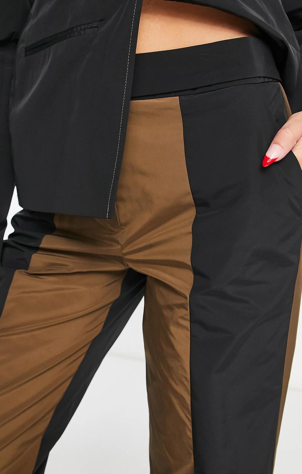 Collusion Straight Spliced Trousers In Black And Brown – trousers by Collusion, available to rent from Hirestreet