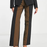 Collusion Straight Spliced Trousers In Black And Brown – trousers by Collusion, available to rent from Hirestreet