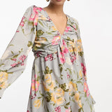 In The Style X Georgia Louise Volume Sleeve Lace-Up Back Flippy Playsuit In Grey Floral – jumpsuits & playsuits by In The Style, available to rent from Hirestreet