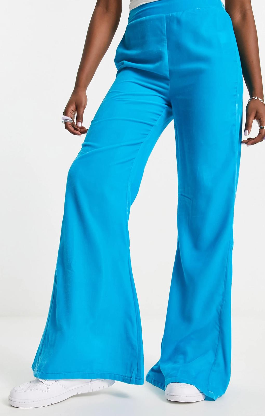 Native Youth High Waist Flare Trousers In Pop Blue Velvet – trousers by Native Youth, available to rent from Hirestreet