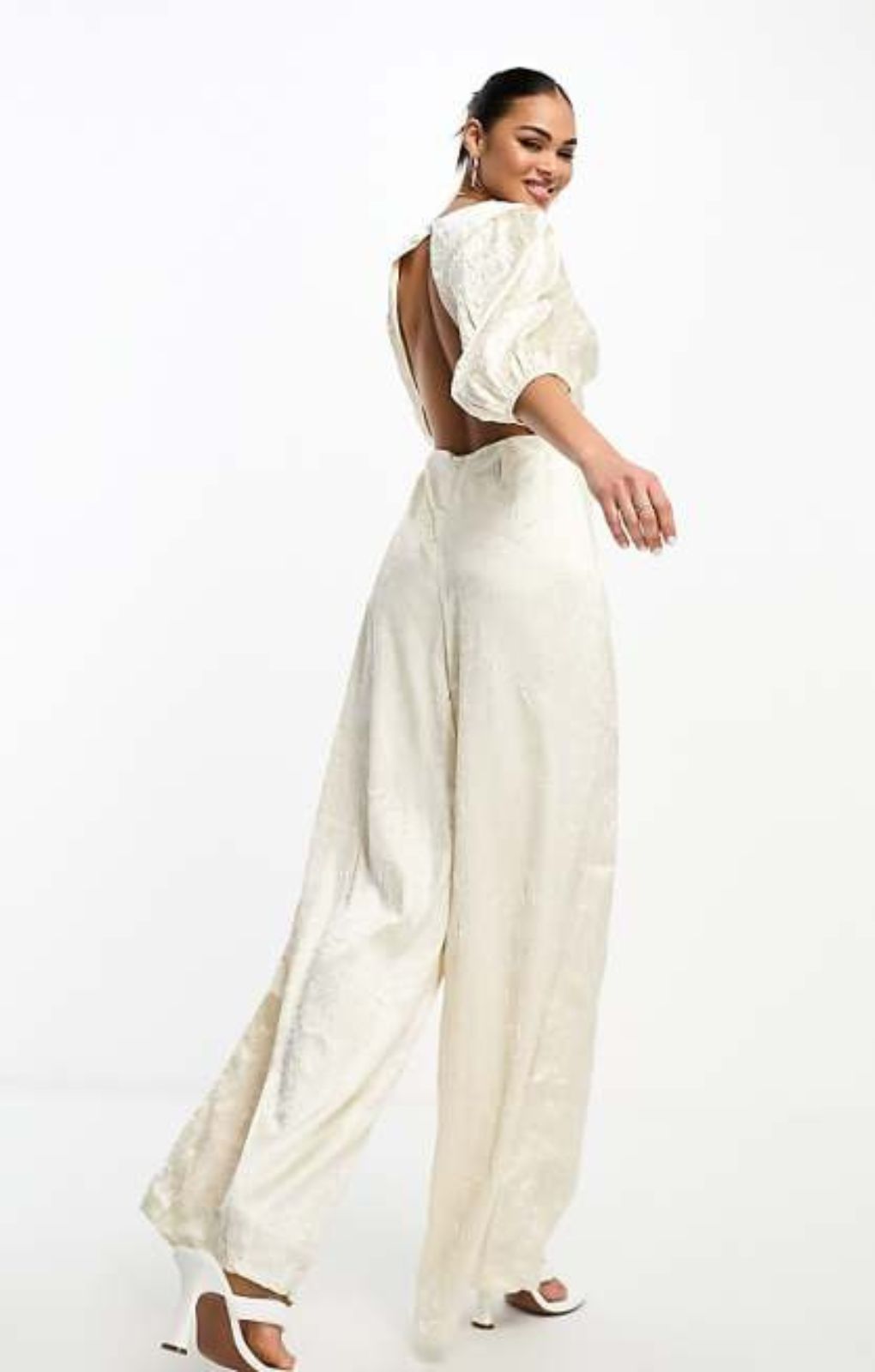 Collective The Label Exclusive Twisted Cut-Out Jumpsuit In Oyster – jumpsuits & playsuits by Collective The Label, available to rent from Hirestreet