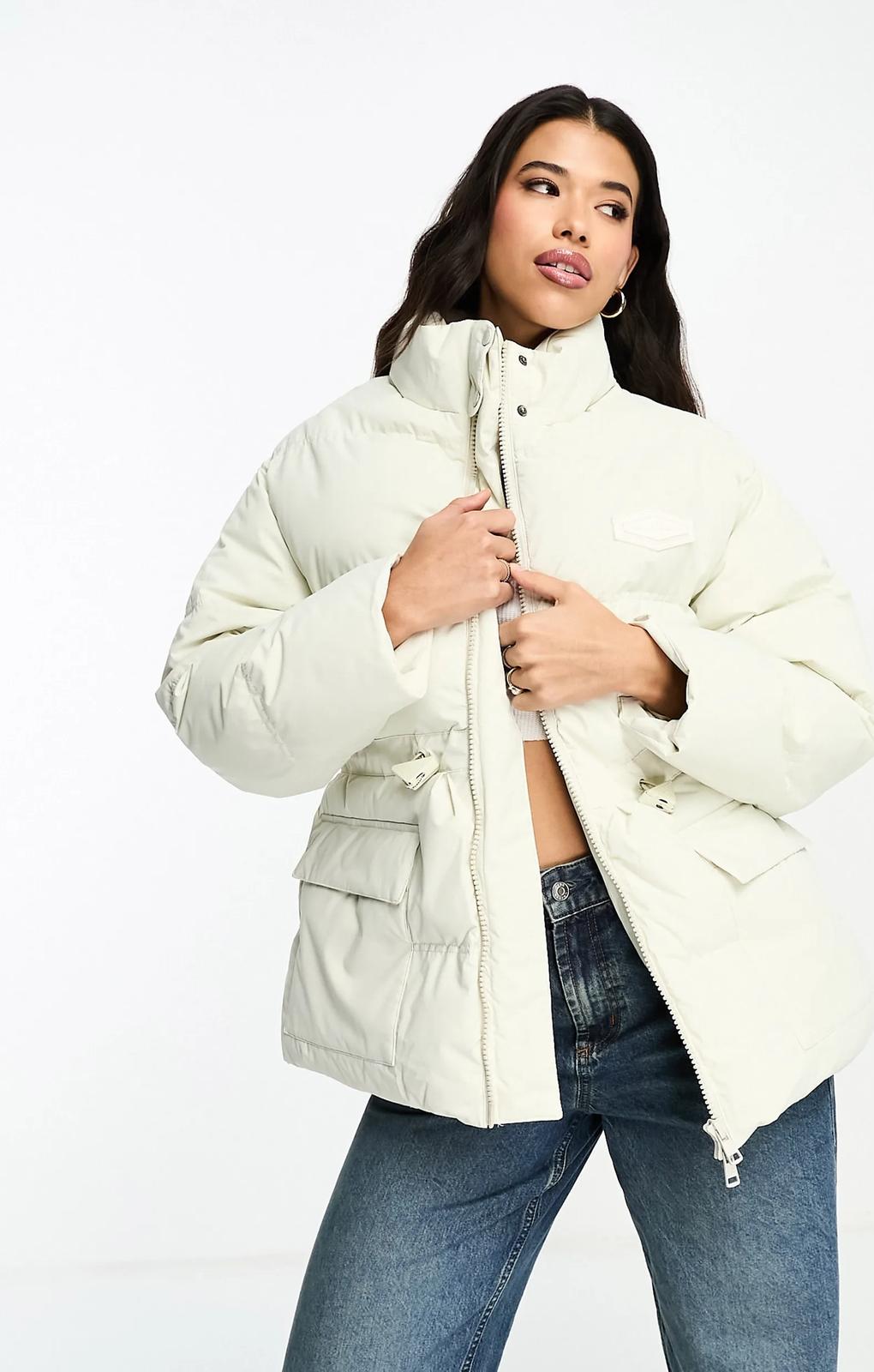 The Couture Club Oversized Pleated Puffer Jacket In Beige With Tie Waist Detail – coats & jackets by The Couture Club, available to rent from Hirestreet