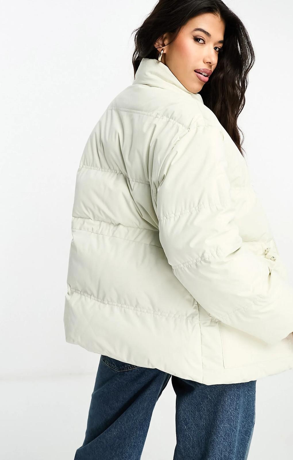 The Couture Club Oversized Pleated Puffer Jacket In Beige With Tie Waist Detail – coats & jackets by The Couture Club, available to rent from Hirestreet