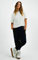 Ivy ParkAdidas Originals x Ivy Park Dog Tooth Joggers In Blue With Green Detail