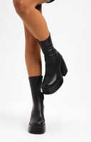 ASOS DESIGN Elated Heeled Chunky Platform Sock Boots In Black