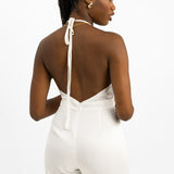 In The Style x Yasmin Devonport Exclusive Satin Halterneck Split Front Detail Wide Leg Jumpsuit In White