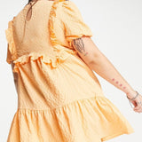 Neon Rose Ruffle Front Smock Dress In Textured Apricot – dresses by Neon Rose, available to rent from Hirestreet