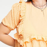Neon Rose Ruffle Front Smock Dress In Textured Apricot – dresses by Neon Rose, available to rent from Hirestreet