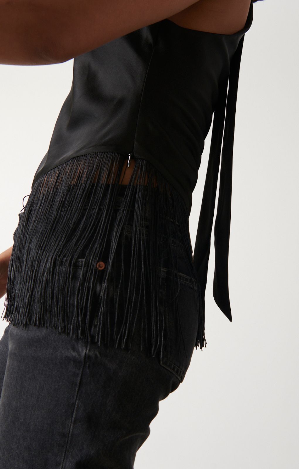 Pretty Lavish Callie Asymmetric Black Fringed Top – tops by Pretty Lavish, available to rent from Hirestreet