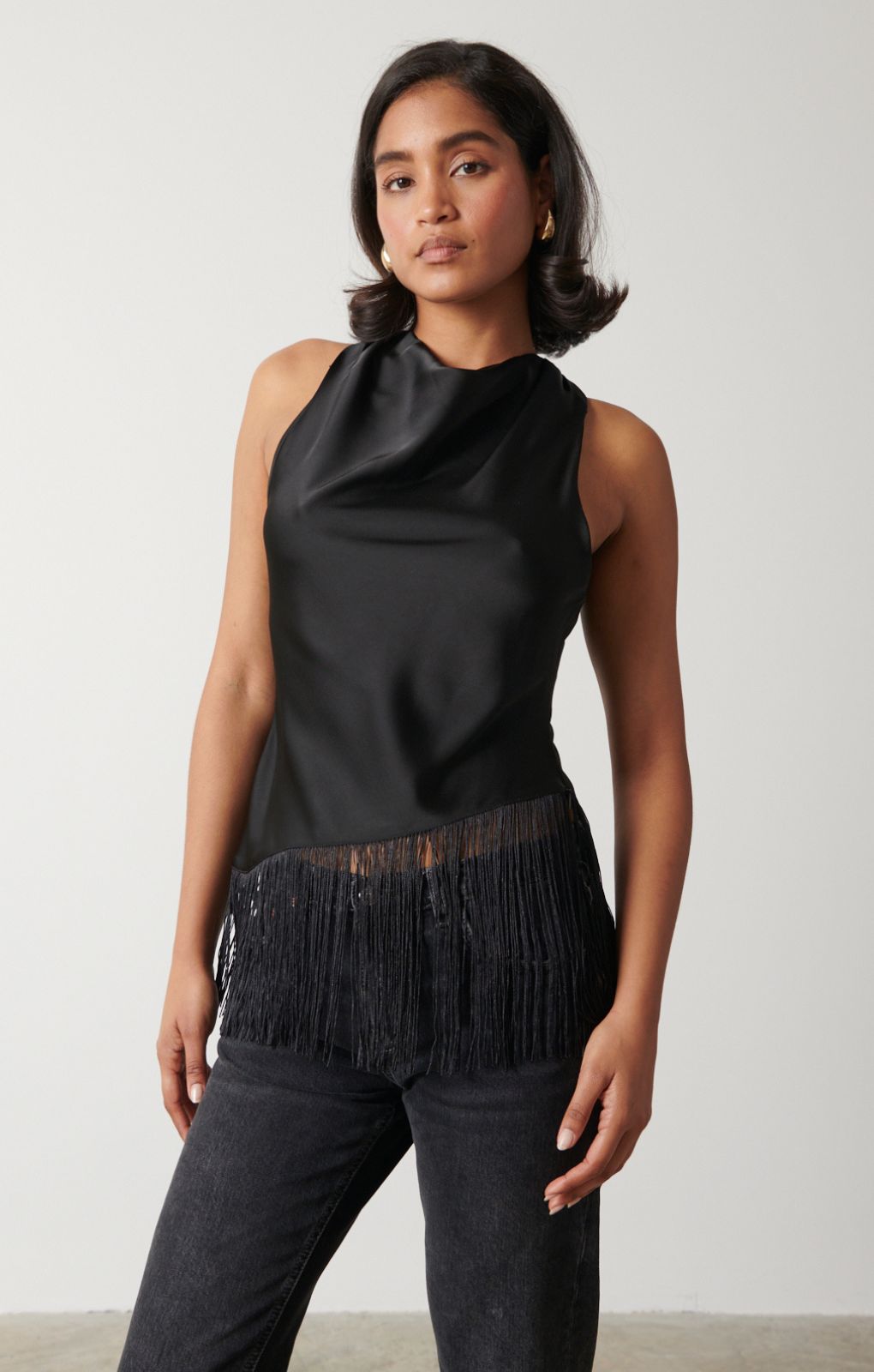 Pretty Lavish Callie Asymmetric Black Fringed Top – tops by Pretty Lavish, available to rent from Hirestreet