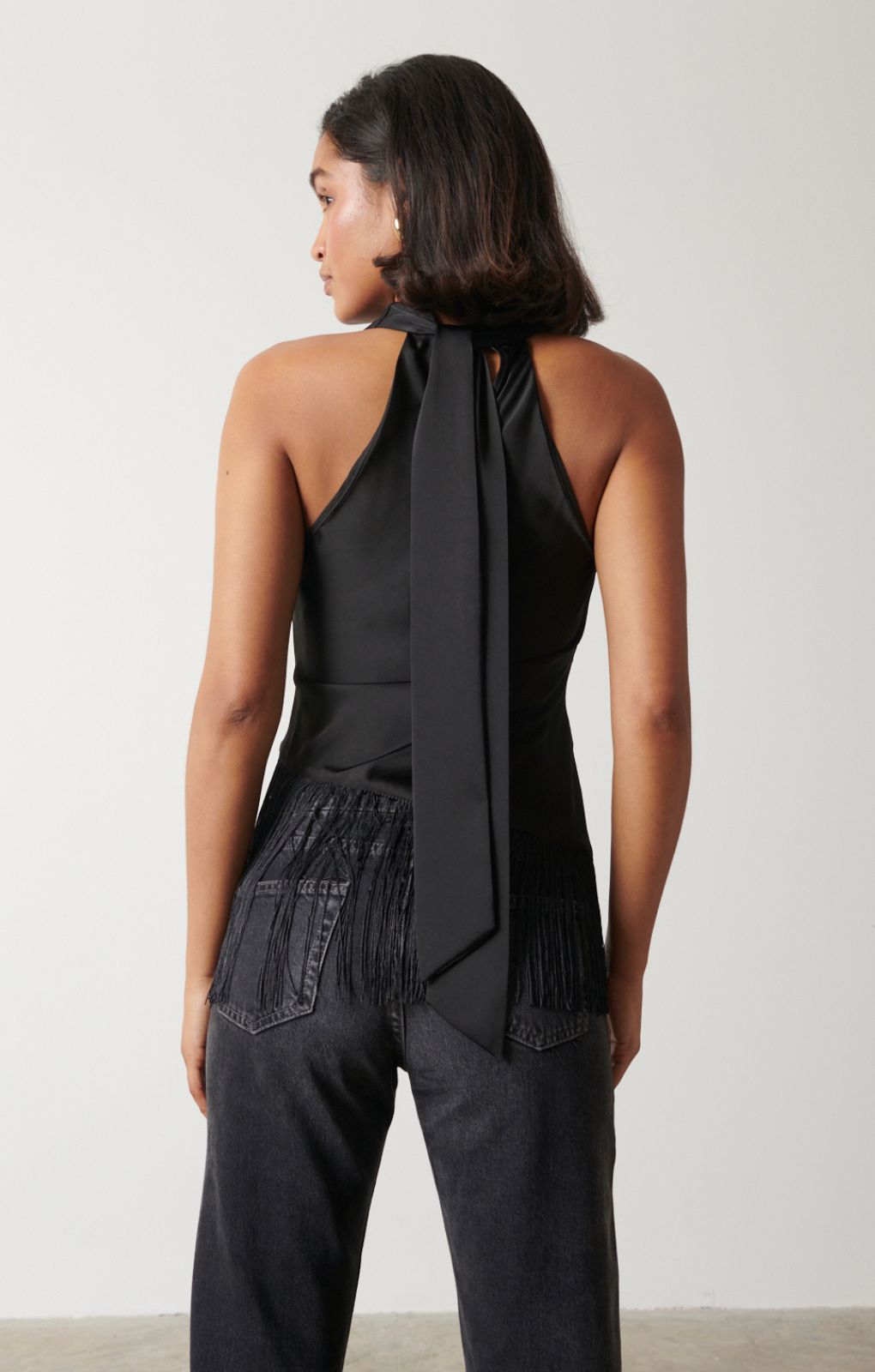 Pretty Lavish Callie Asymmetric Black Fringed Top – tops by Pretty Lavish, available to rent from Hirestreet