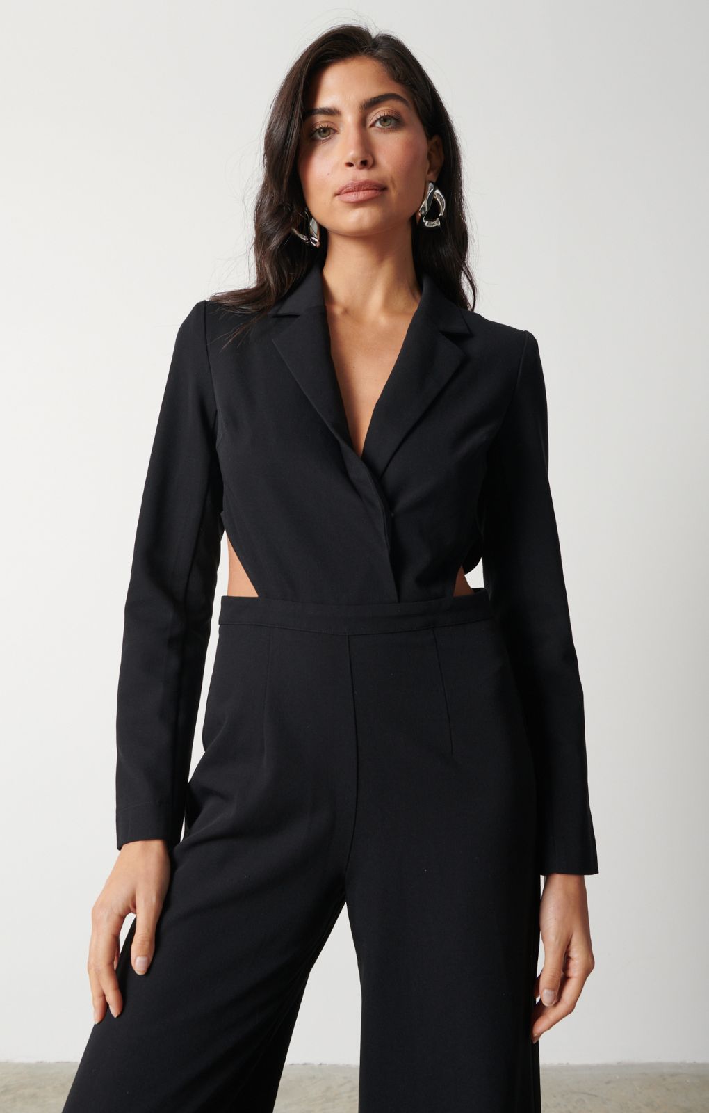 Pretty Lavish Marni Cut Out Black Jumpsuit – jumpsuits & playsuits by Pretty Lavish, available to rent from Hirestreet