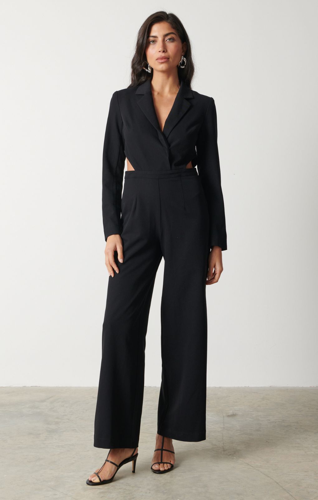 Pretty Lavish Marni Cut Out Black Jumpsuit – jumpsuits & playsuits by Pretty Lavish, available to rent from Hirestreet