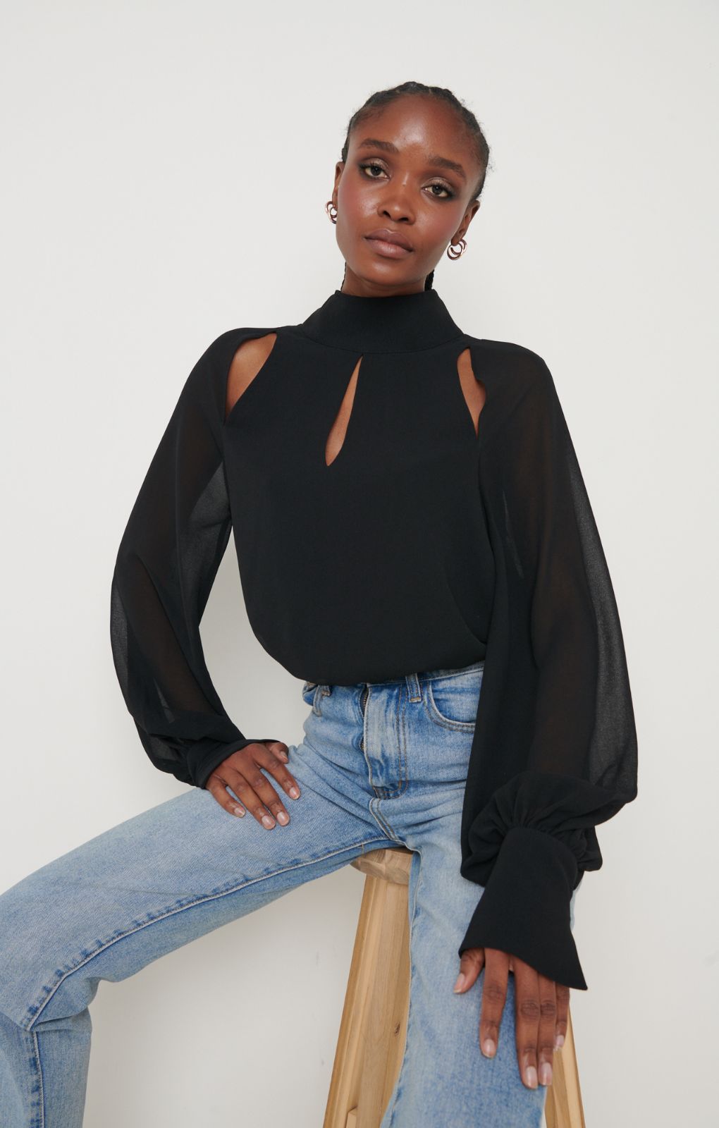 Pretty Lavish Romy Cut Out High Neck Black Blouse – tops by Pretty Lavish, available to rent from Hirestreet