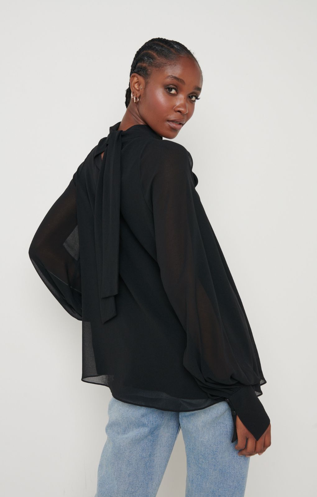 Pretty Lavish Romy Cut Out High Neck Black Blouse – tops by Pretty Lavish, available to rent from Hirestreet