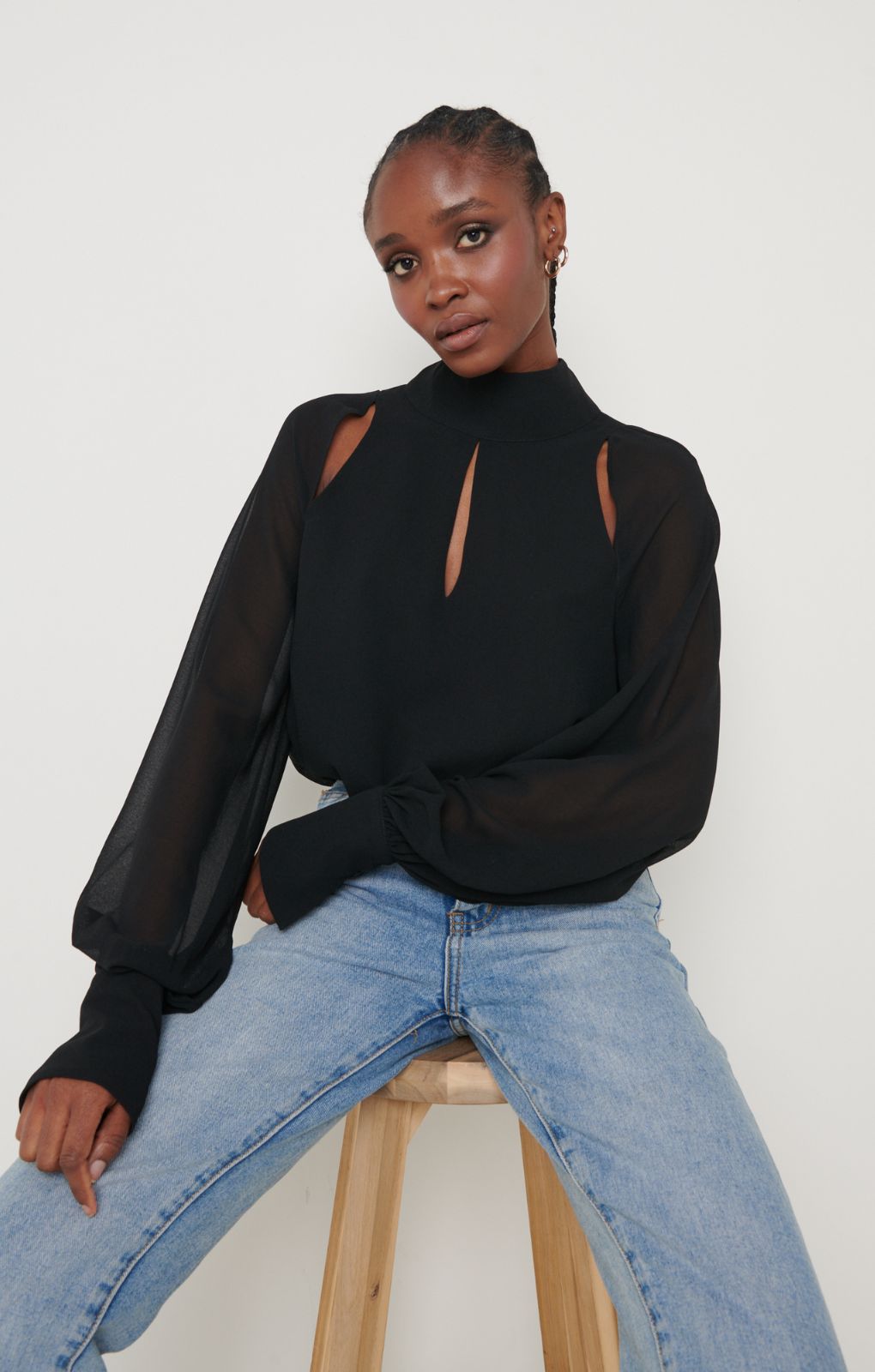 Pretty Lavish Romy Cut Out High Neck Black Blouse – tops by Pretty Lavish, available to rent from Hirestreet