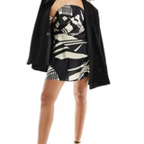 Asos Design Satin Bandeau Asymetric Hem Mini Dress With Ruched Bodice Detail In Mono Abstract Print – dresses by ASOS DESIGN, available to rent from Hirestreet