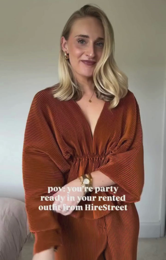 ASOS EDITION Wide Leg Plisse Pleat Front Trouser In Rust – trousers by ASOS EDITION, available to rent from Hirestreet