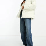 The Couture Club Oversized Pleated Puffer Jacket In Beige With Tie Waist Detail